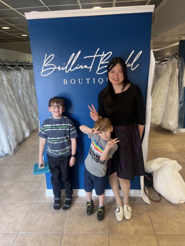 Ying poses with her nephew at Brilliant Bridal Las Vegas