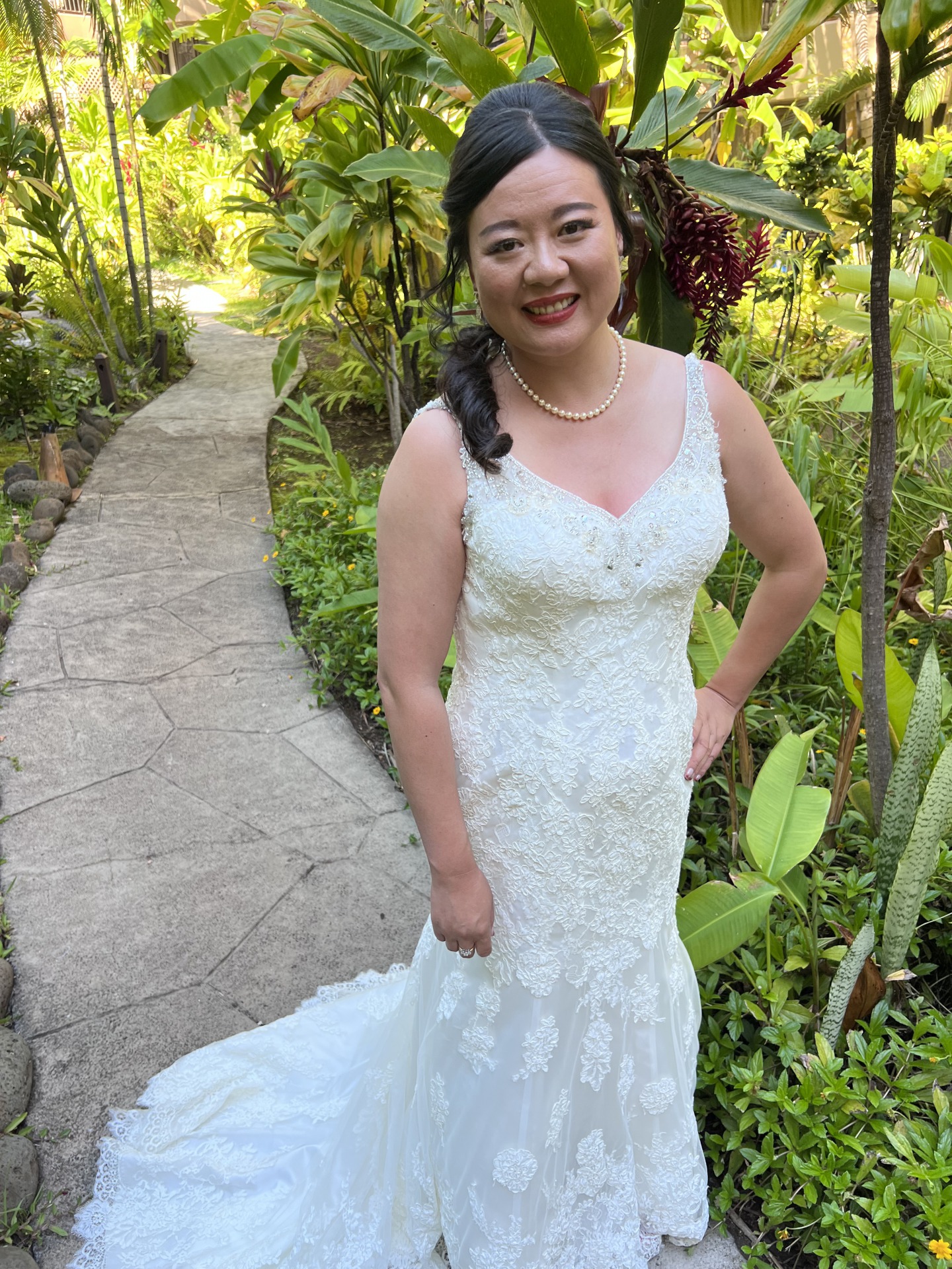 Ying before her wedding modeling off her altered gown that now fits perfectly